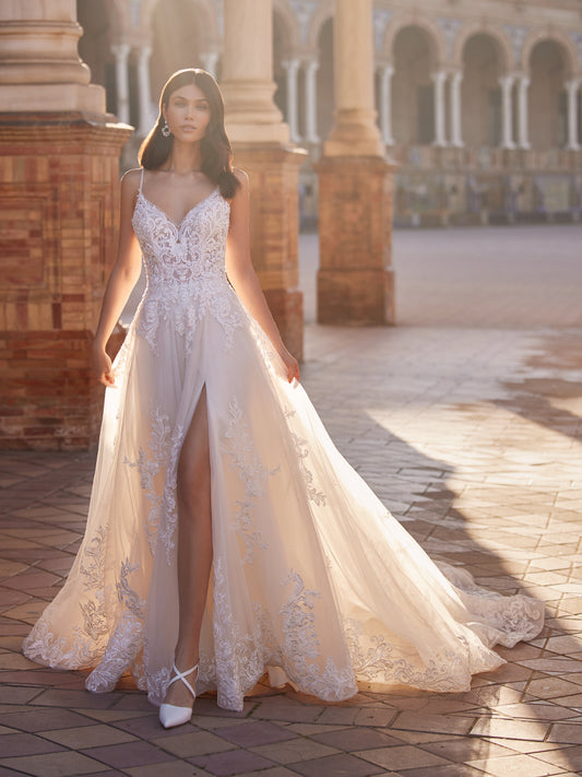 Woman wearing Moonlight Couture H1547 A-line wedding dress with leg visible